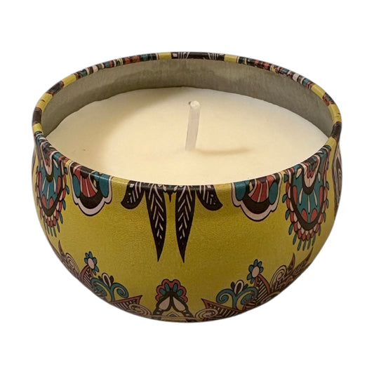 Candle in a decorative container with a colorful pattern on a white background