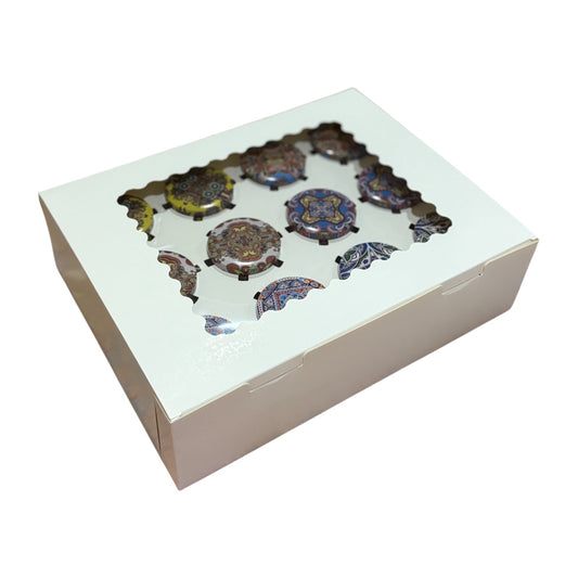 Cardboard box with decorative items on a white background